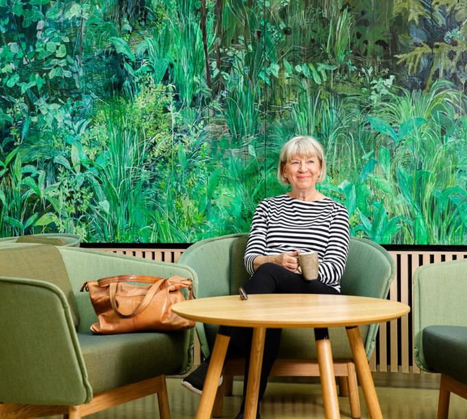 Woman sits at a café.